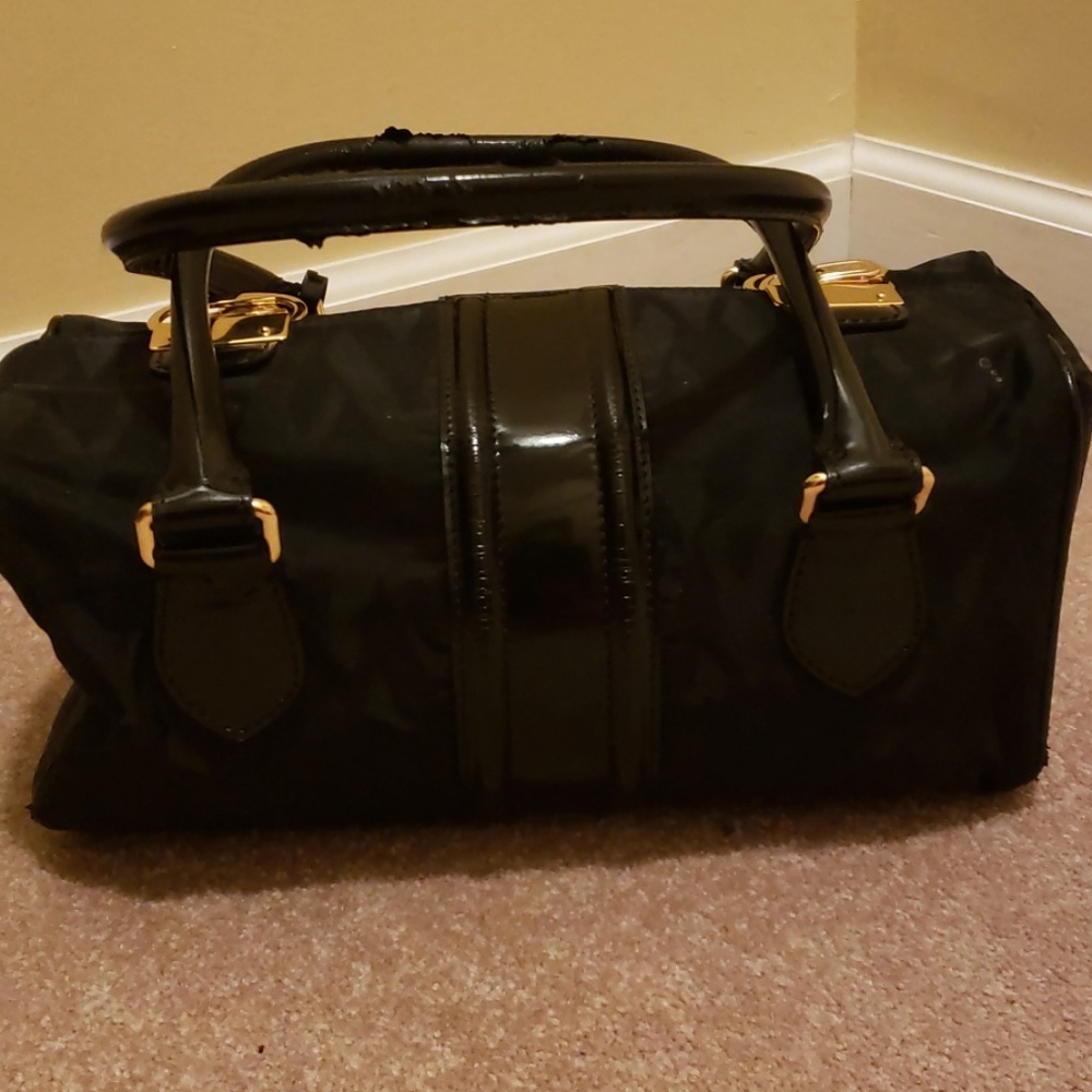 Valentino top handle bag with gold snap closure